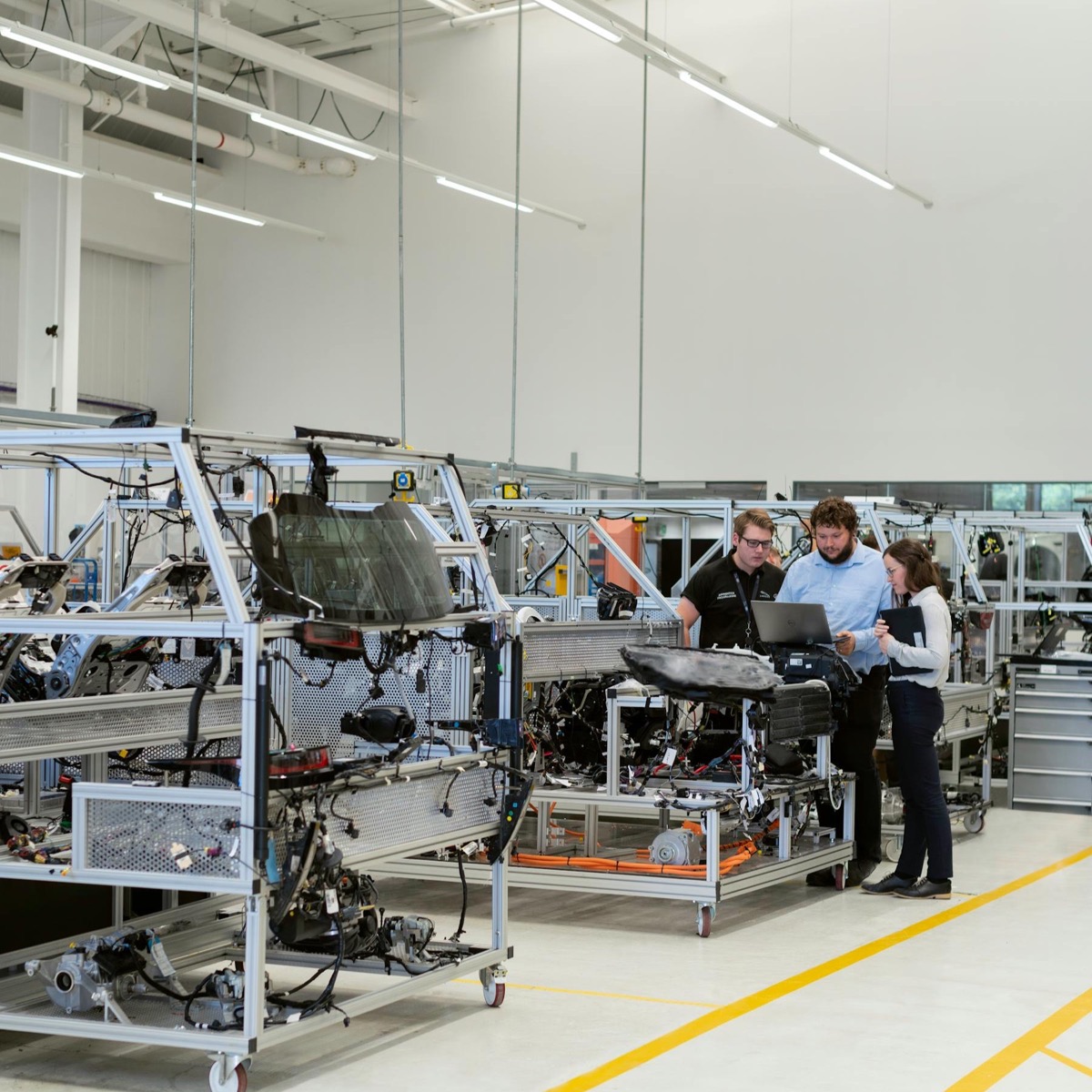 Carlisle engineers reviewing a project together on the plant floor